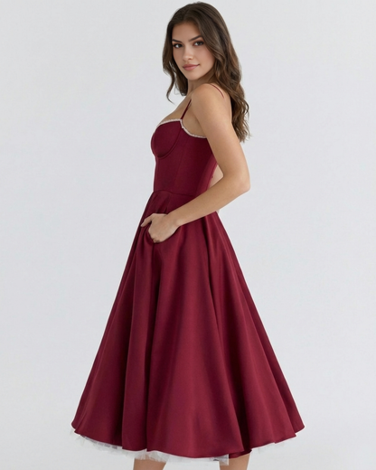 Vestido midi con corsé y falda amplia
